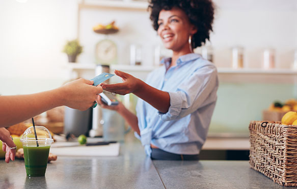 Person using a debit card at a restaurant