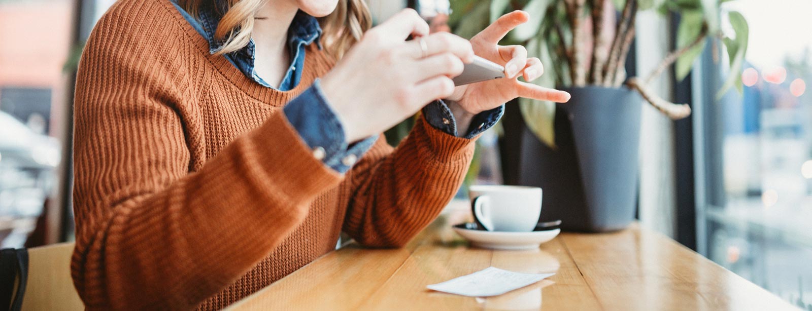 Lady making a deposit with Mobile Banking